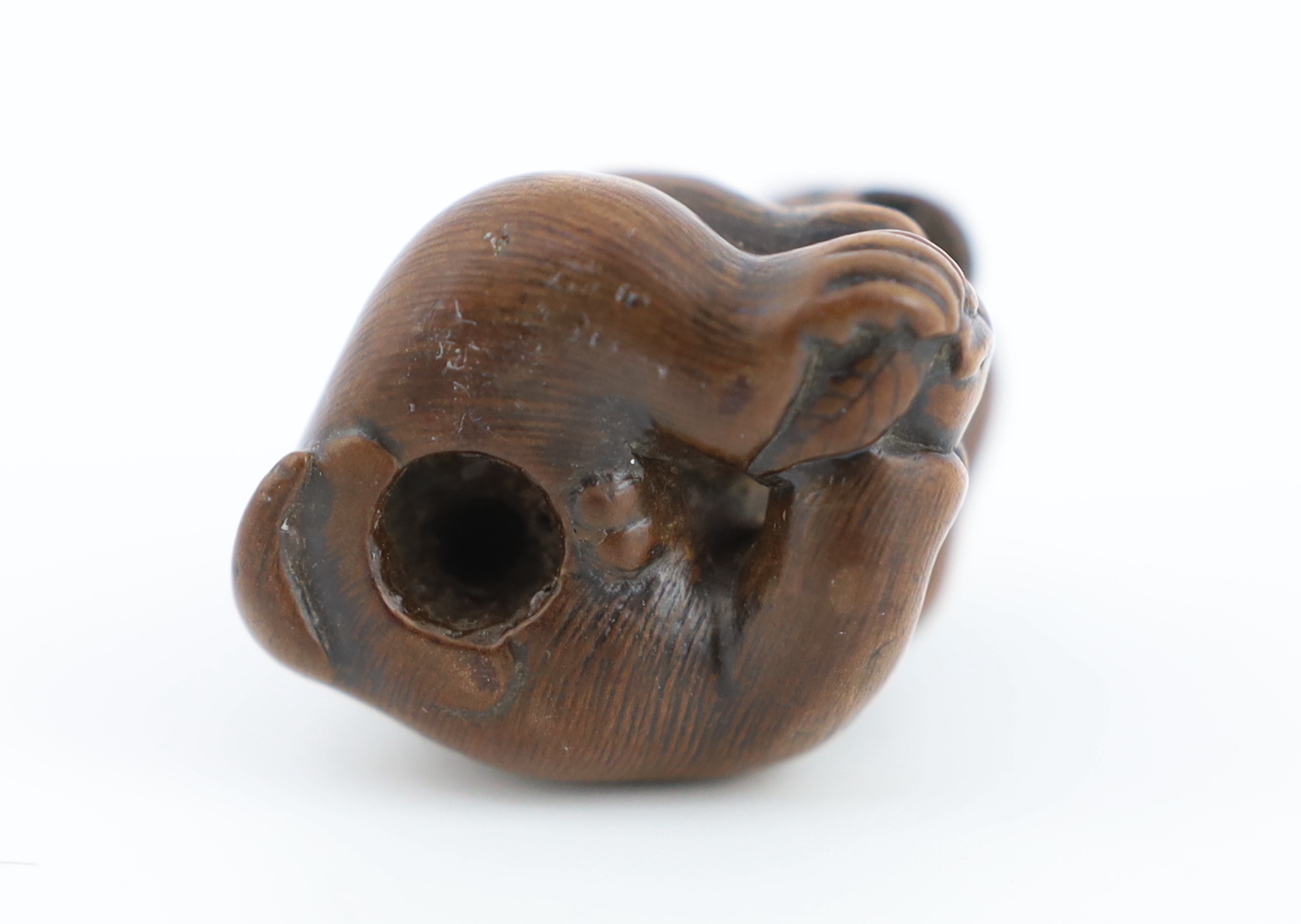A Japanese carved wood netsuke of an ape, Tamba School, 19th century